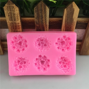 Pink silicone mold with 6 rose flower cavities for DIY cake baking and soap making
