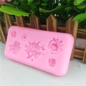 Pink silicone mold with six unique 3D rose flower shapes for cake fondant and soap crafting