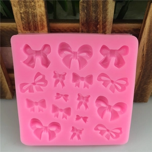 Pink silicone bow mold with 15 cavities for fondant baking and DIY resin crafts