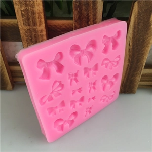 Pink silicone mold with 15 bow-knot shapes for DIY fondant cake and chocolate baking