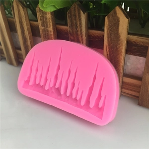 Pink silicone mold featuring forest tree silhouettes for fondant cake border decoration