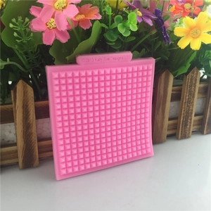 Pink square silicone waffle grid lace mat mold for cake decorating and DIY baking projects