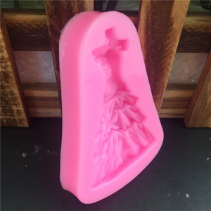 Pink silicone fondant mold featuring an elegant bridal wedding dress for cake decorating