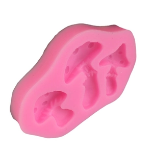 Pink silicone mold featuring three mushroom shapes for fondant cake decorating and crafts