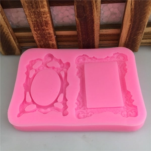 Pink silicone mold with dual oval and rectangular ornate frame designs for fondant cakes