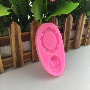Pink silicone DIY mold for fondant and chocolate featuring decorative gear and lace patterns