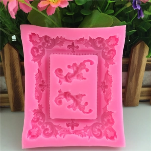 Pink silicone mold featuring baroque lace frame and scrolls for fondant cake decorating