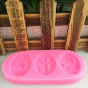 Pink silicone fondant mold with detailed skull girl and floral relief carvings