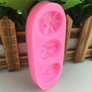 Pink silicone fondant mold with three oval cavities for DIY cake decorating and crafts