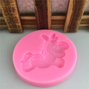 Pink silicone fondant mold featuring a cartoon horse shape for cake baking and DIY crafts