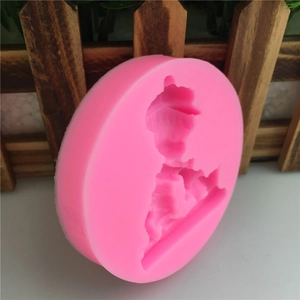 Pink silicone mold for DIY fondant and baking featuring a cartoon boy design shape