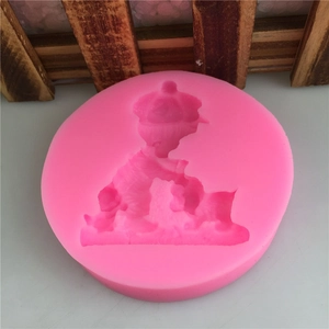 Pink silicone mold featuring a boy and cat design for DIY fondant cake baking and crafts