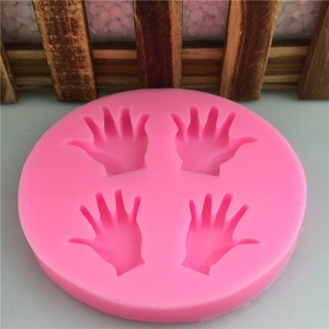Pink silicone mold featuring four pairs of hand palm patterns for fondant and DIY cake baking