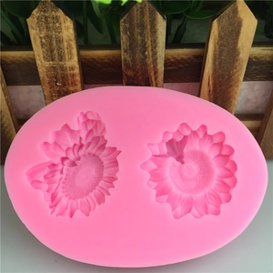 Pink silicone mold with two sunflower cavities for DIY fondant cake baking and crafts