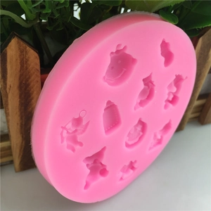 Pink silicone baby mold for fondant cakes featuring stars and angel relief patterns