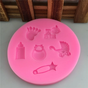 Pink round silicone mold for baby themed fondant and chocolate cakes with stroller shapes