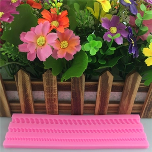 Pink silicone fondant mold featuring three distinct woven rope texture designs for cake decorating