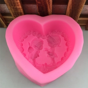 Pink heart-shaped silicone fondant mold with embossed couple and rose border