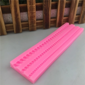 Pink silicone bead mold with three sizes of pearl strands for fondant cake decoration