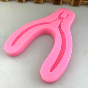 Pink silicone mold with pliers shape for DIY fondant cake decoration and craft projects