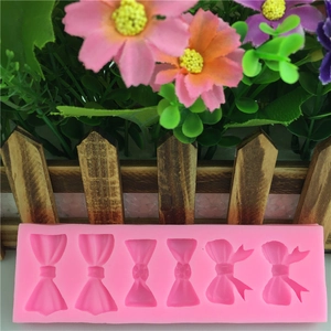Moule en silicone rose avec six motifs de nœuds pour décoration de gâteaux et artisanat
