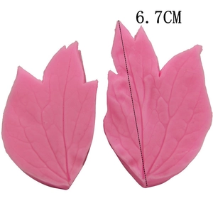 Detail view of pink leaf-shaped silicone molds with realistic vein textures, 6.7cm height