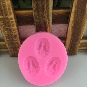 Pink 3D silicone mold with three sets of birds for fondant and cake decoration