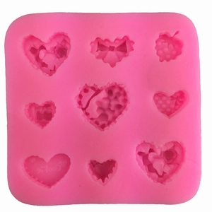 Pink silicone heart mold with 9 distinct cavity patterns for cake decorating and DIY