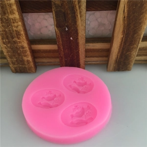 Pink silicone mold featuring 3D embossed bird and floral patterns for fondant and DIY crafts