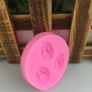 Detail of round pink 3-cavity silicone bird mold for fondant cake and chocolate baking