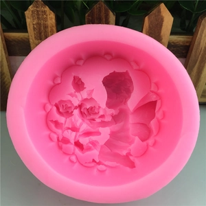 Pink silicone mold with detailed rose flower pattern for handmade soap and candle making