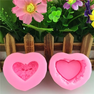 Pink heart-shaped silicone molds set with rose floral texture for DIY baking and crafts