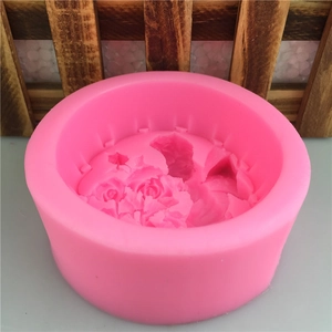 Pink round silicone mold for angel wing and rose cakes, soap making or candle crafting