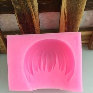 Pink silicone mold for handmade fondant cakes featuring a detailed short hair fringe design