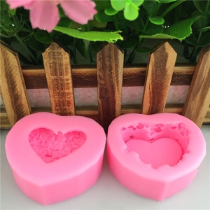 Pink heart-shaped silicone molds for fondant cakes and DIY jewelry boxes with floral relief