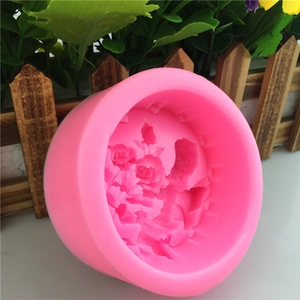 Pink silicone mold featuring rose floral relief for handmade soaps and fondant cakes