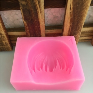 Pink rectangular silicone mold with circular hairstyle texture for fondant or soap making