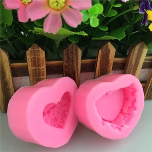 Pink heart-shaped silicone molds with floral relief for DIY soap and chocolate making