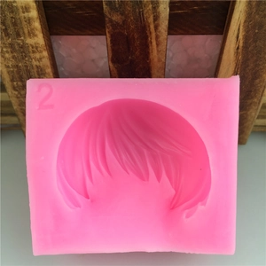 Pink silicone fondant mold featuring short hair style design with number 2 label