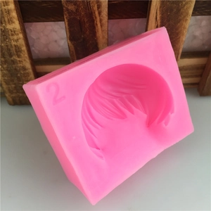 Pink silicone mold for short hair fondant styling featuring detailed texture and number 2