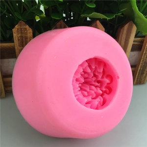 Macro detail of the floral petal texture inside the pink silicone fondant mold cavity