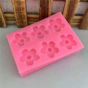 Pink silicone mold with 6 five-petal flower cavities for DIY chocolate fondant making