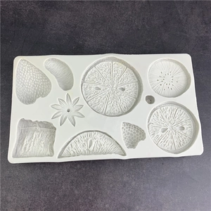 Silicone fruit mold for fondant baking featuring strawberry and citrus slice shapes