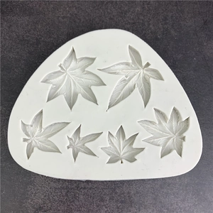 White silicone maple leaf mold for DIY cake decorating and fondant with 6 detailed leaf shapes