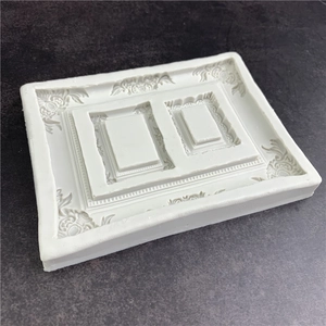 White silicone mold for three-hole relief photo frames with vintage floral patterns