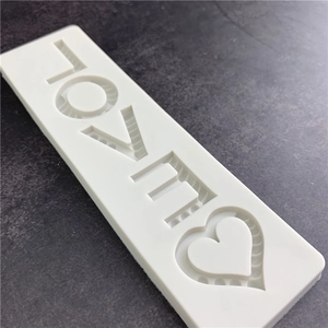 White silicone mold for cake decor featuring LOVE letters and heart shapes for DIY resin crafts