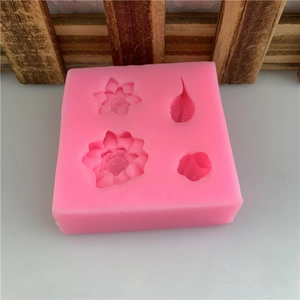 Pink silicone mold with lotus and koi patterns for handmade soap and cake fondant decoration