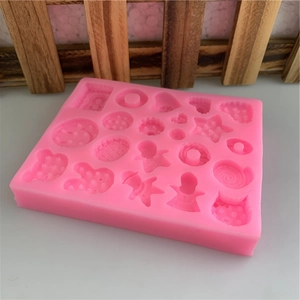 Pink silicone mold with 18 cavities featuring bear, rabbit, and star shapes for DIY crafts