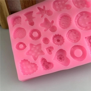 Pink silicone mold featuring hearts and stars for DIY chocolate or soap making