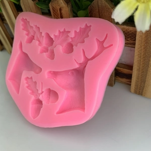 Pink silicone mold with reindeer head and pine cones for Christmas cake fondant crafts